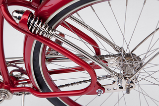 Those are the modified remains of a Monark-style fork and some custom mounts on a customized 1938 Elgin Men’s frame.